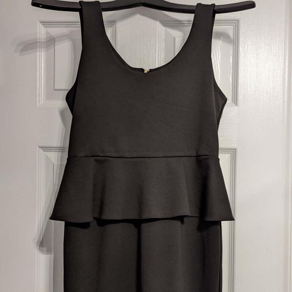Black sleeveless peplum mini dress size medium New with tags